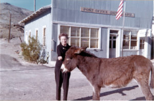 Oatman post office, gift shop, postmaster, and burro, 1965