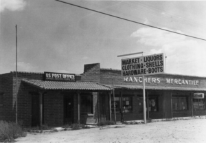 Building with US Post Office and Ranchers Mercantile; Market, Liquors, Clothing, Shells, Hardware, Boots