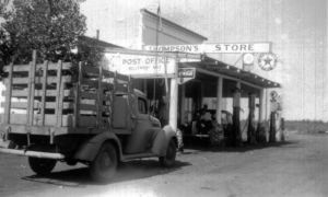 Truck pulling up in front of Bellemont post office, also the Thompson's store, which sells gasoline as well