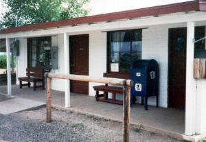 Cochise post office with hitching post in parking lot