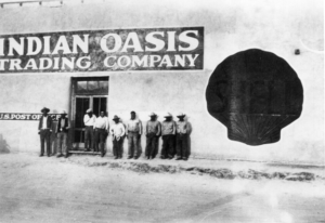 Men standing outside Indian Oasis Trading Company