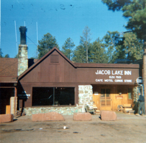 Exterior rock building with peaked roof and Jacob Lake Inn signage